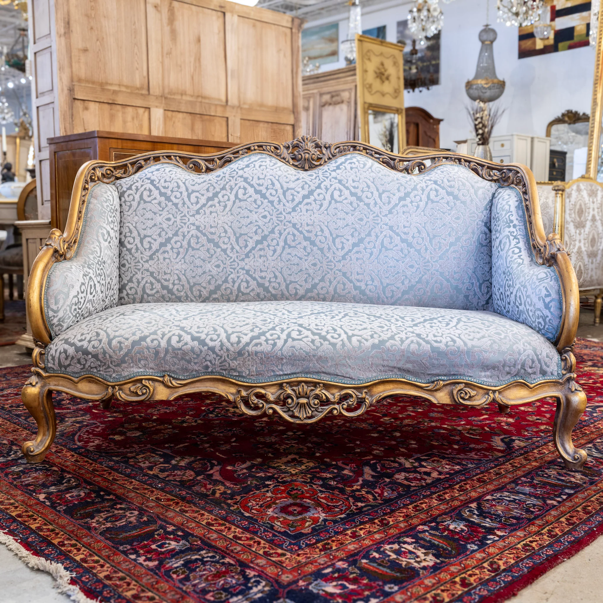Louis XV Gilded Sofa – Detailed Carvings & Blue Damask Upholstery
