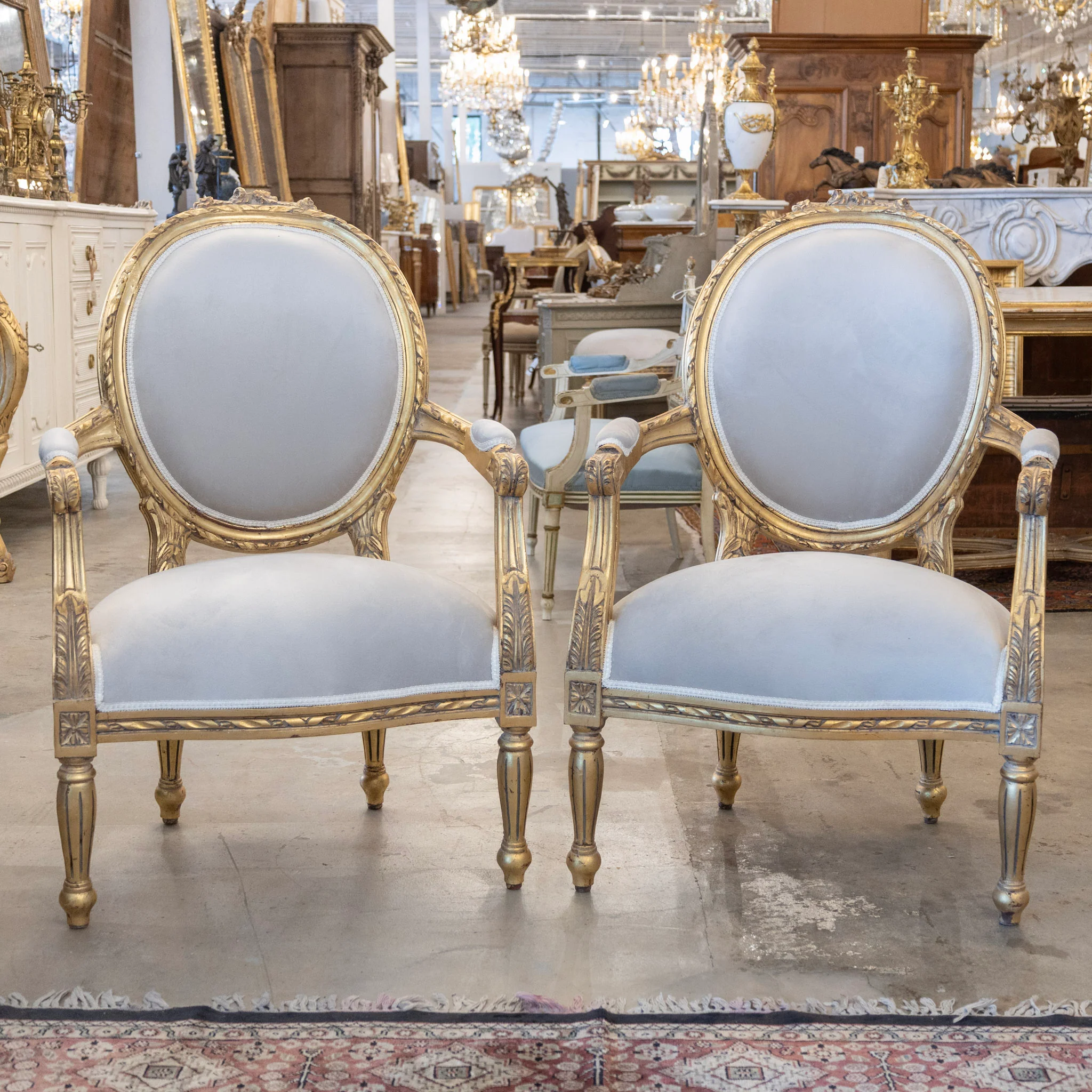 Pair of Louis XVI Gilded Oval Arm Chairs – Light Gray Velvet Upholstery